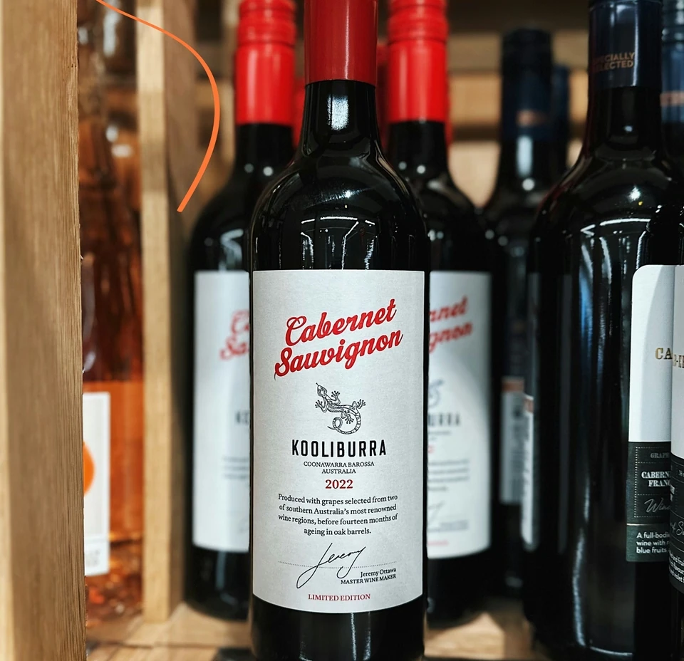 Kooliburra Cabernet Sauvignon 2022 bottle displayed among other bottles on a wooden shelf