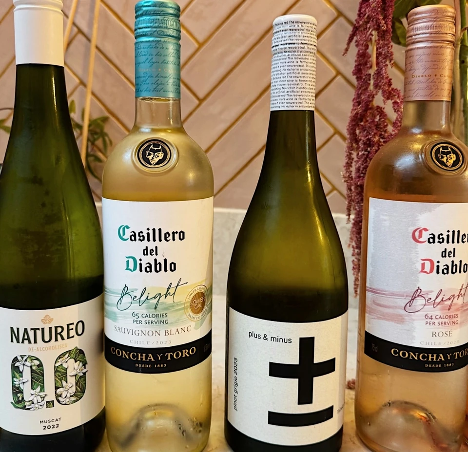 Four bottles of wine, including Casillero del Diablo Chilean wine