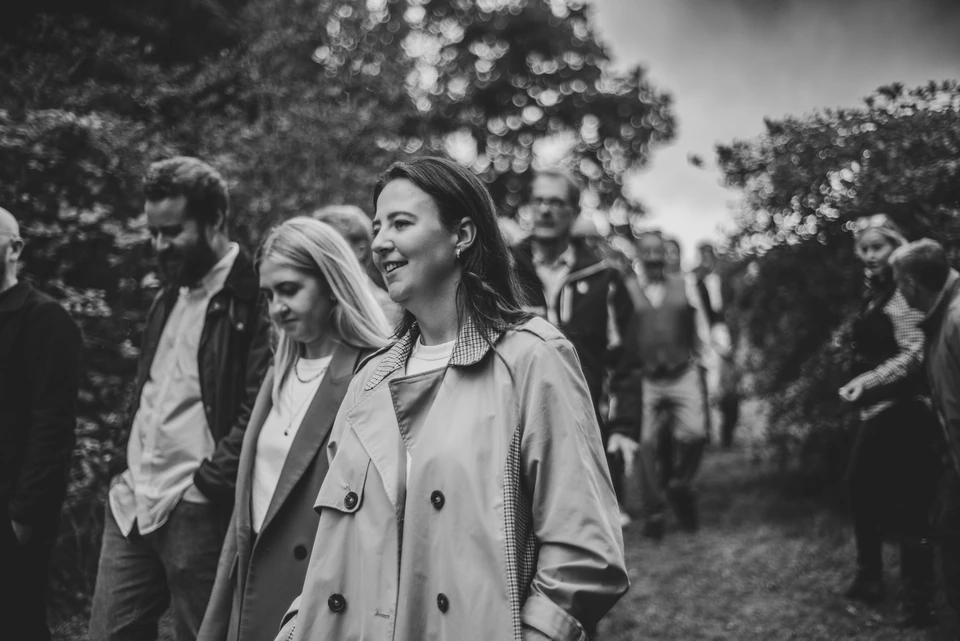 Guests mingle outdoors at a launch event