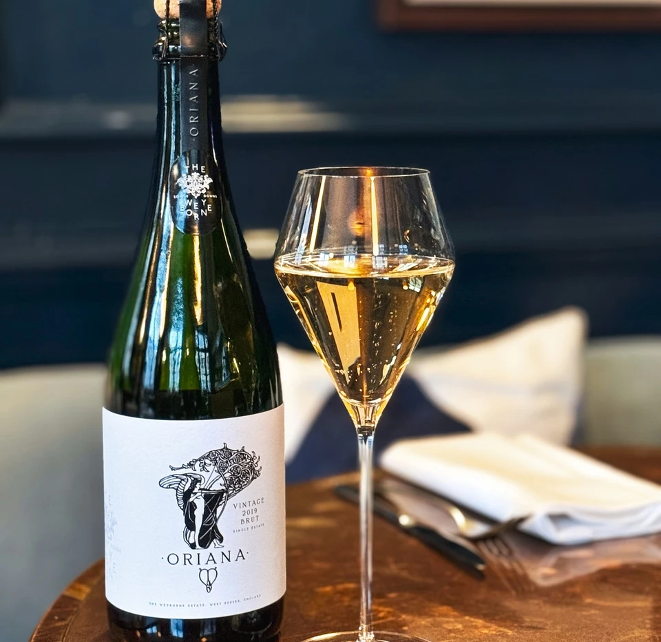 Oriana Vintage 2019 Brut bottle beside a glass of sparkling wine at Clarette