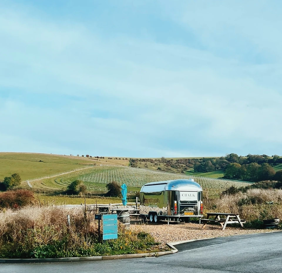 Wiston vineyard with rows of vines and a silver CHALK trailer