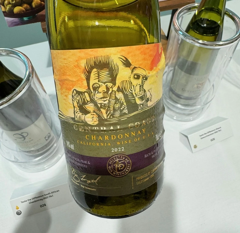 California Chardonnay bottle displayed with tasting glasses, olives and tasting notes