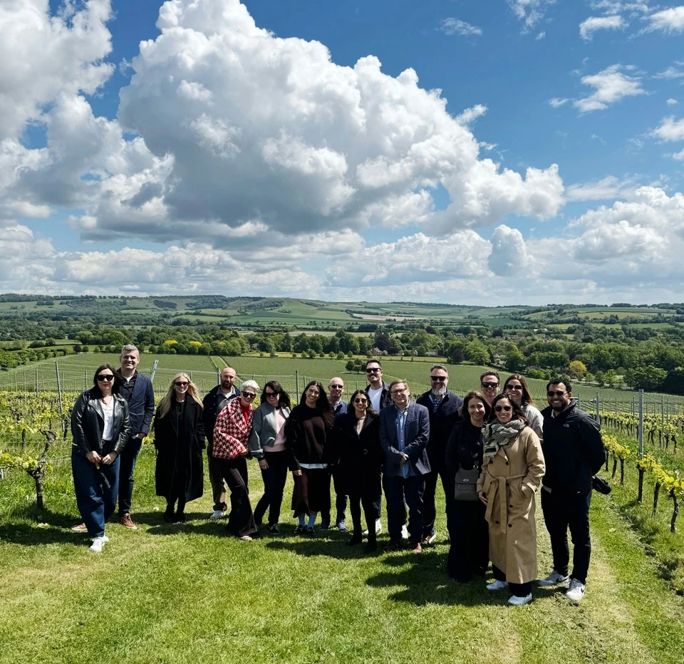 Group standing together among the vines at Exton Park