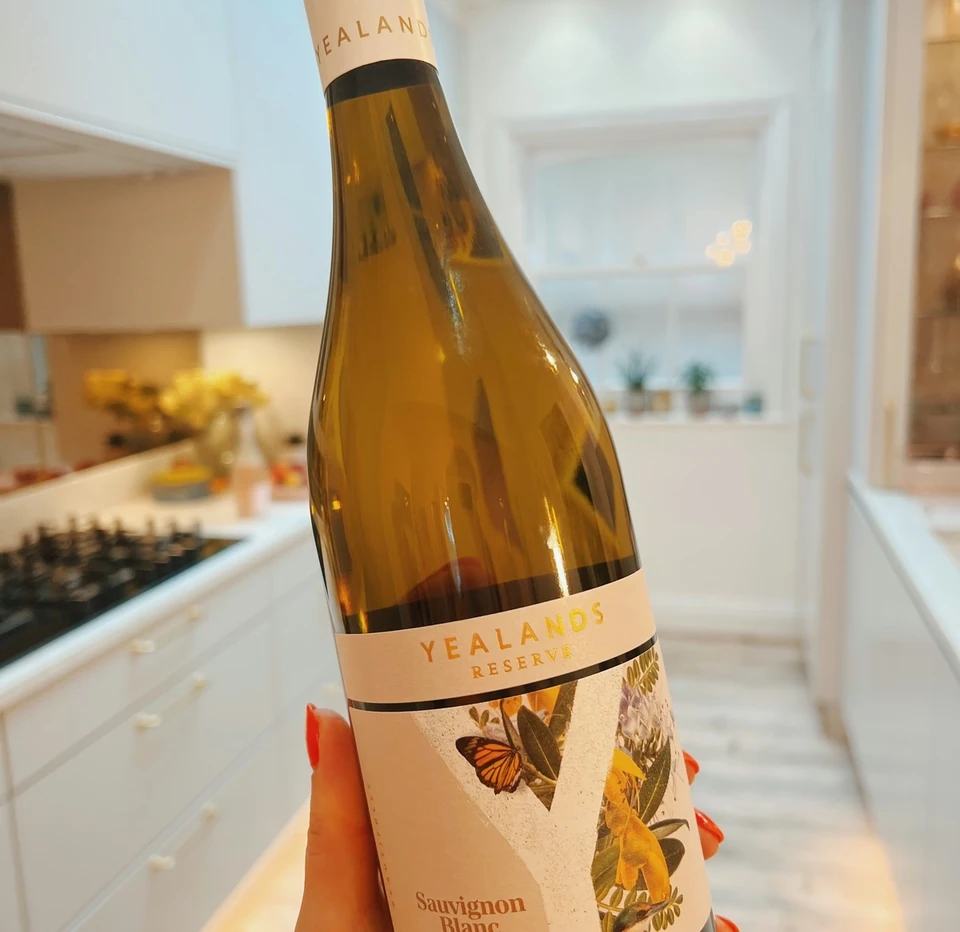 Yealands Reserve Sauvignon Blanc bottle from Marlborough held in a bright kitchen