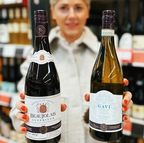 Bottles of Beaujolais Supérieur and Gavi in a wine shop