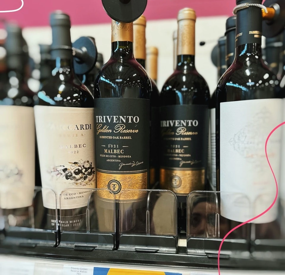 Trivento Golden Reserve Malbec bottles on a Tesco shelf with a Clubcard price of £12.50