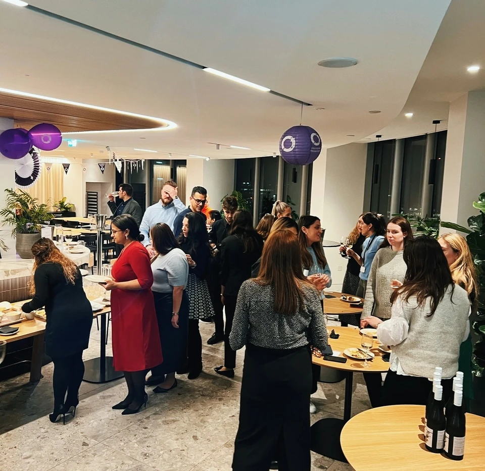 Guests mingle at a wine tasting for Simpson Thacher and Barrett