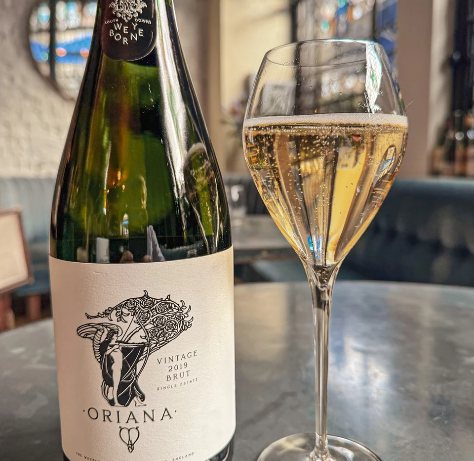 Weyborne Oriana Vintage 2019 sparkling wine and a glass at Clarette, London