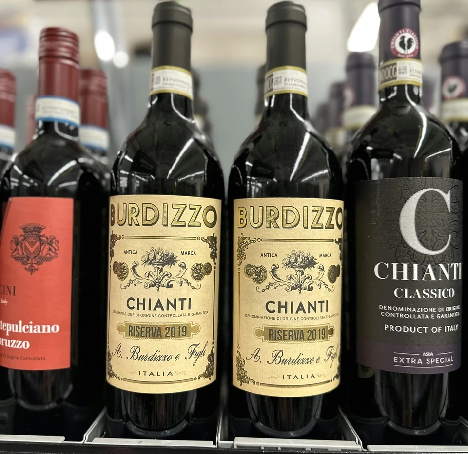 Chianti bottles, including Burdizzo Chianti Riserva 2019, displayed on a wine shelf
