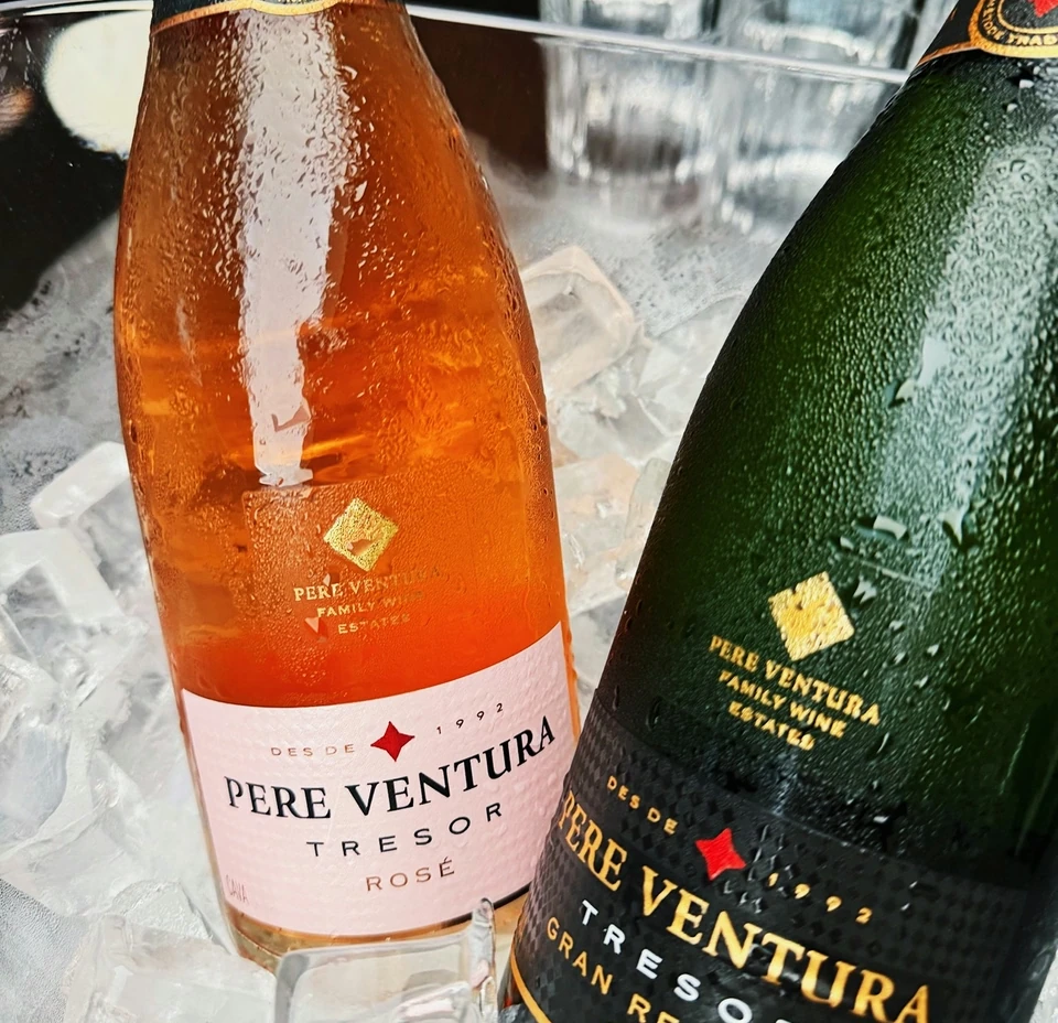 Chilled Pere Ventura rosé and Gran Reserva sparkling wine bottles displayed on ice