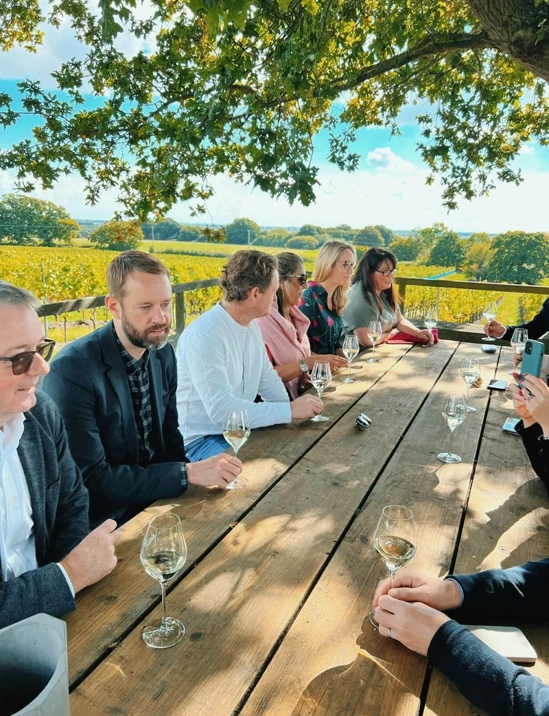 Adults tasting wine at Gusbourne vineyard