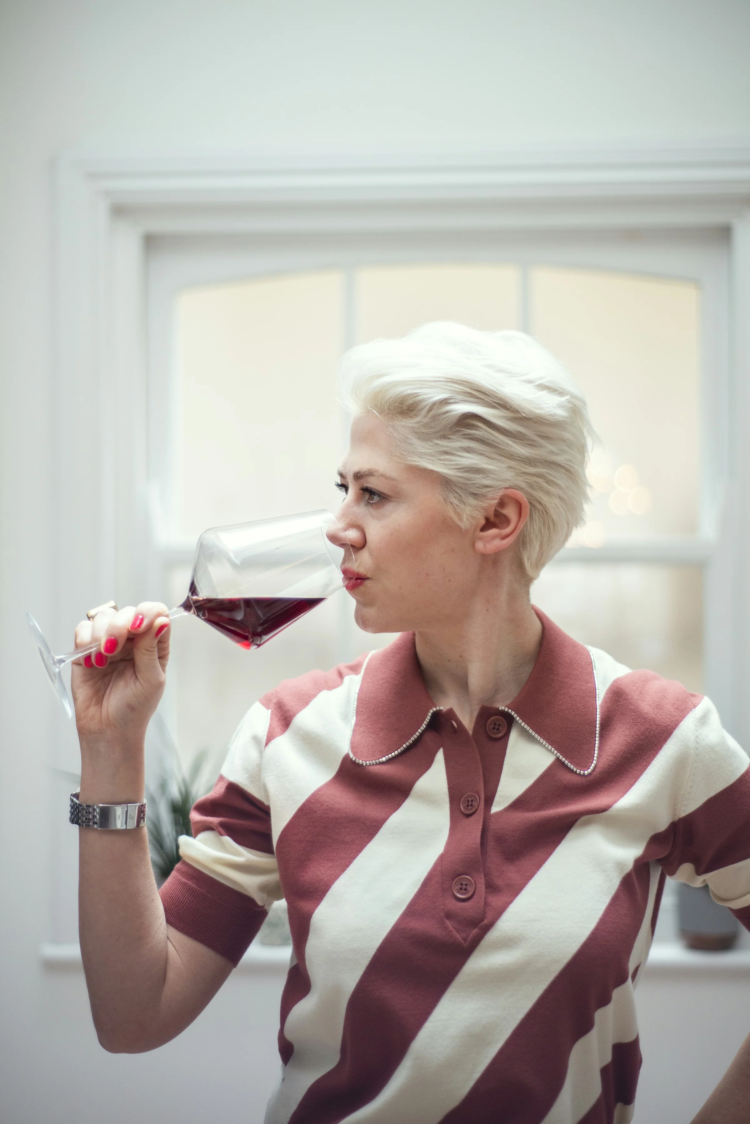 Elizabeth Hawthornthwaite tasting a glass of red wine