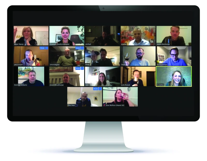 A screen of guests on a video call, each with a glass of wine